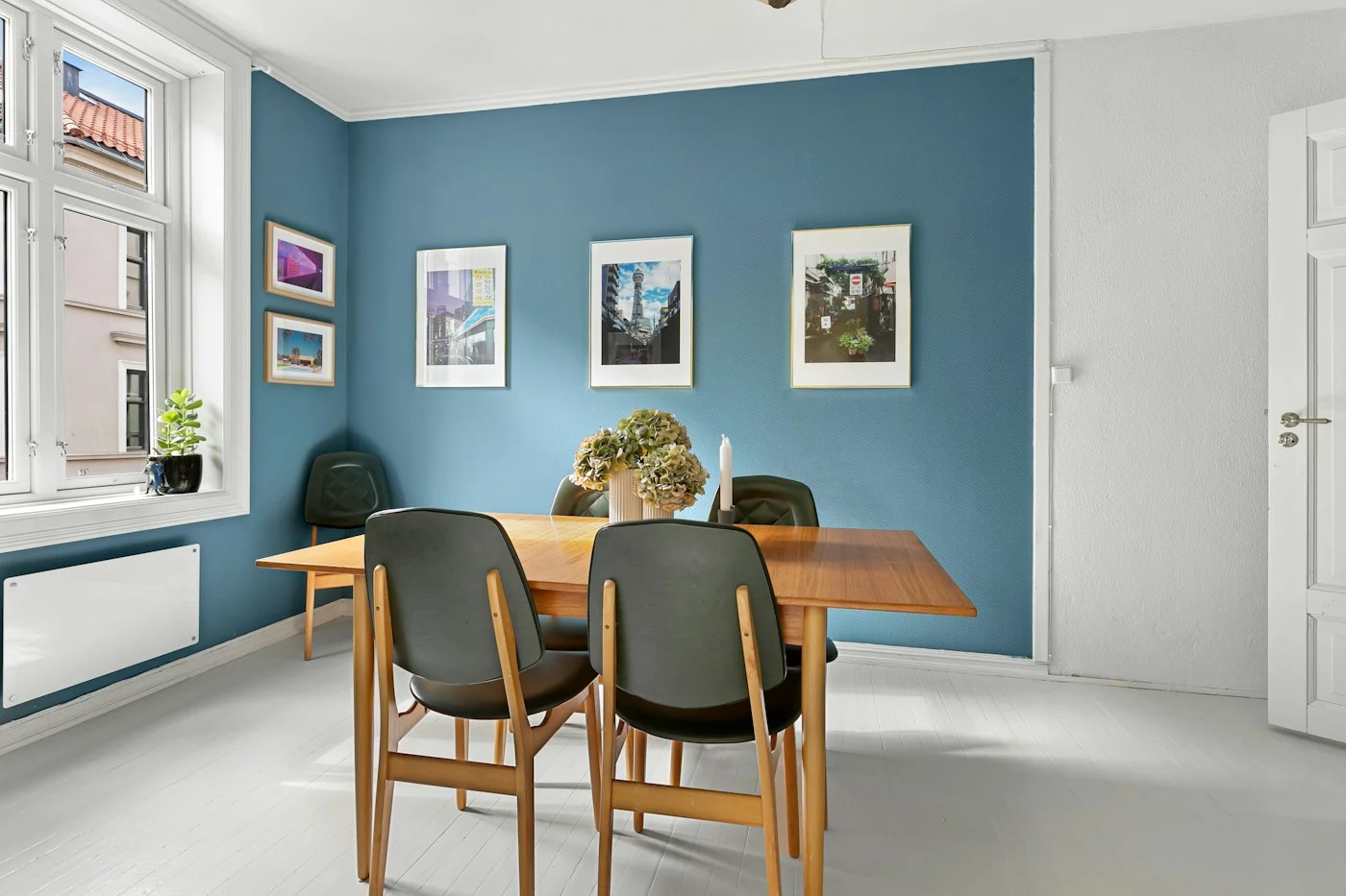 Dining room with blue walls and white trim